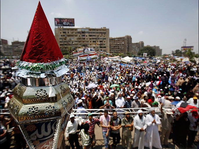 A Ramadan lantern, or Fanoos Ramadan, is displayed during the Muslim fasting month of Ramadan, as members of the Muslim Brotherhood and supporters of deposed Egyptian President Mohamed Mursi protest at the Rabaa Adawiya square, where they are camping at, in Cairo July 11, 2013. Political infighting threatened to stall Egypt's transition plans on Thursday, as the military cracked down on Muslim Brotherhood leaders it blames for inciting a clash in Cairo in which troops shot and killed 53 protesters. Monday's violence between supporters of Mursi, Egypt's first freely elected leader toppled by the army last week, and soldiers at a military compound has opened deep fissures in the Arab world's most populous country. REUTERS/Amr Abdallah Dalsh (EGYPT - Tags: POLITICS CIVIL UNREST RELIGION)