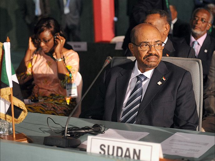 Sudan's President Omar al-Bashir takes part in the African Union Summit on health focusing on HIV/AIDS, TB and malaria in Abuja on July 15, 2013. Nigeria's presidency today defended welcoming Sudan President Omar al-Bashir to the country for an African Union health summit despite war crimes charges against him, saying it cannot interfere in AU affairs. AFP PHOTO / PIUS UTOMI EKPEI