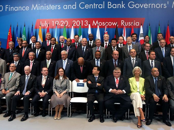 epa03794206 Central bankers and Finance Ministers wait Russian Finance Minister Anton Siluanov for a group photo during the G20 Finance Ministers and Central Bank Governor's Meeting 2013 in Moscow, Russia, 20 July 2013. Central bankers and Finance Ministers from the G20 countries hold a two-day meeting with talks expected to focus on measures to prevent large companies from shifting their profits to tax havens. EPA/MAXIM SHIPENKOV