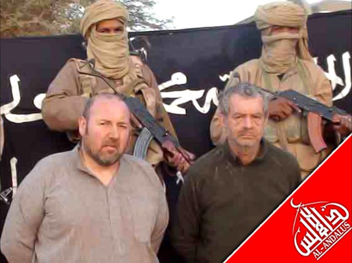 (FILES) An undated file handout image released by Al-Andalus, the media branch of Al-Qaeda in the Magreb (AQMI) to the Agence Nouakchott Informations (ANI) on December 9, 2011, shows French nationals Philippe Verdon (R) and Serge Lazarevic (L) being held by AQMI at an undisclosed loaction. The two Frenchmen were captured in Hombori in Northern Mali on November 24, 2011. French President Francois Hollande confirmed on July 15, 2013 the death of Verdon, who had been kidnapped by Al-Qaeda in the Islamic Maghreb (AQIM) from a hotel while on business in northeastern Mali in November 2011. The French Foreign Ministry said on July 14 that the body of the French hostage, who was announced killed by his Al-Qaeda captors in March, had "very likely" been found in Mali. AFP PHOTO / ANI / AQMI