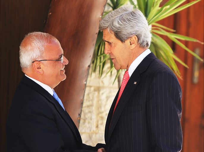 epa03713006 U.S. Secretary of State John Kerry (R) shake hands with Palestinian Chief of Negotiator Saeb Erekat (R) upon his arrival for a meeting with Palestinian President Mahmoud Abbas (not pictured) in the West Bank city of Ramallah on 23 May 2013. Kerry held talks in the Middle East on 23 May with the agenda including an attempt to resuscitate the moribund Israeli-Palestinian peace process. Kerry met Israeli Prime Minister Benjamin Netanyahu in Jerusalem in the morning before talks with the Palestinian leadership in the nearby central West Bank city of Ramallah in the early afternoon. EPA/FADI AROURI / XINHUA / POOL EPA/FADI AROURI / XINHUA / POOL