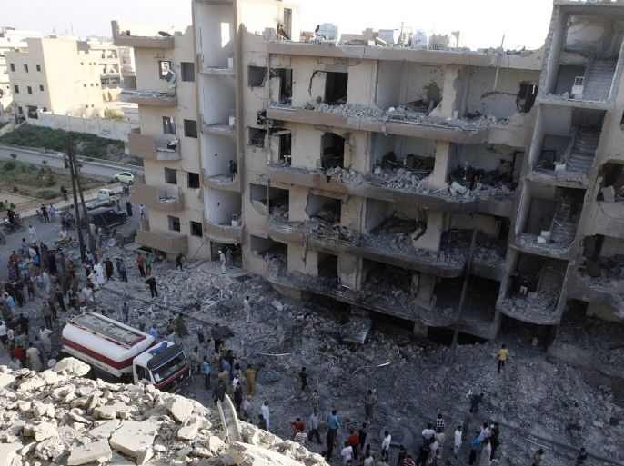 A general view shows damaged buildings caused by what activists said was shelling by forces loyal to Syrian President Bashar al-Assad in Raqqa province, eastern Syria, August 7, 2013.
