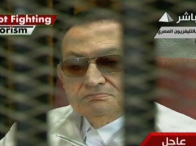 n image grab taken from the Egyptian state TV shows Egypt's ousted dictator Hosni Mubarak sitting in the defendants' cage on August 25, 2013 during his trial in Cairo. Mubarak attended his trial on charges of inciting the murder of protesters, days after he was released from prison and placed under house arrest. AFP PHOTO/EGYPTIAN TV == RESTRICTED TO EDITORIAL USE - MANDATORY CREDIT "AFP PHOTO / EGYPTIAN TV" - NO MARKETING NO ADVERTISING CAMPAIGNS - DISTRIBUTED AS A SERVICE TO CLIENTS ===