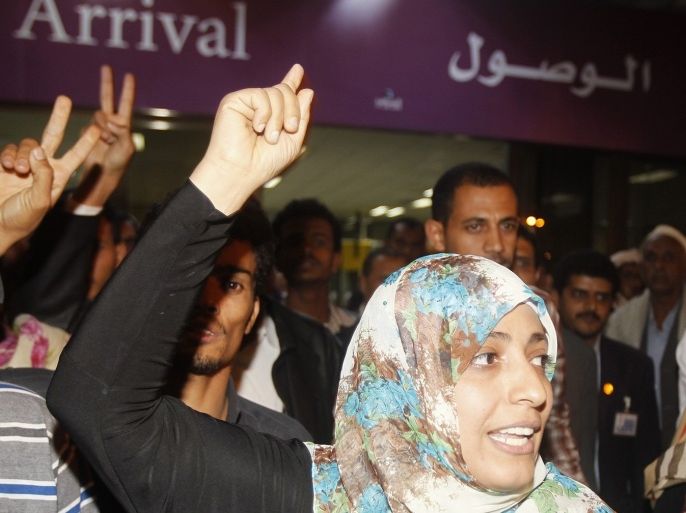 Nobel Peace Prize winner Tawakul Karman of Yemen gestures as she leaves Sanaa International Airport upon her arrival from Egypt August 4, 2013. Egyptian airport authorities have barred Nobel prize-winning Yemeni peace activist Karman, a supporter of deposed president Mohamed Mursi, from entering the country, security sources said on August 4, 2013. State news agency MENA said Karman, who had previously announced her solidarity with supporters of Mursi, overthrown by the army a month ago, was on a list of people who were not allowed to enter Egypt.