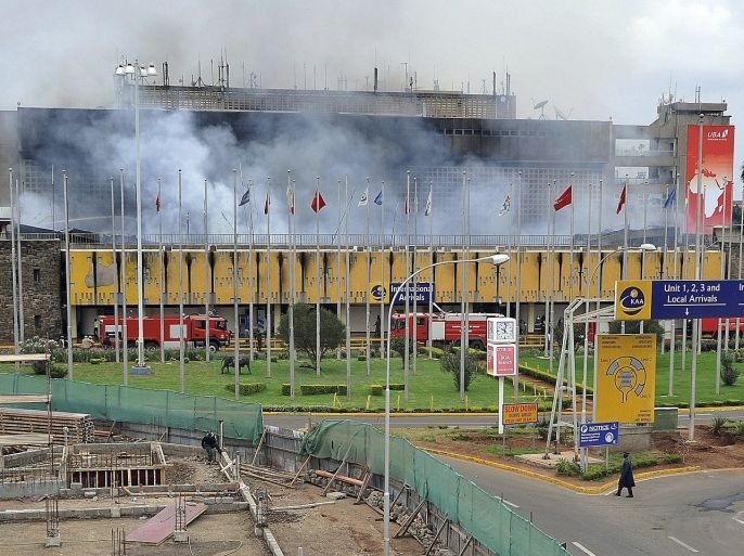 Smoke rises from the Jomo Kenya International Airport in Nairobi on August 7, 2013 as a massive fire shut down the country's main airport with flights diverted to regional cities and firefighters battled to put out the blaze in east Africa's biggest transport hub.