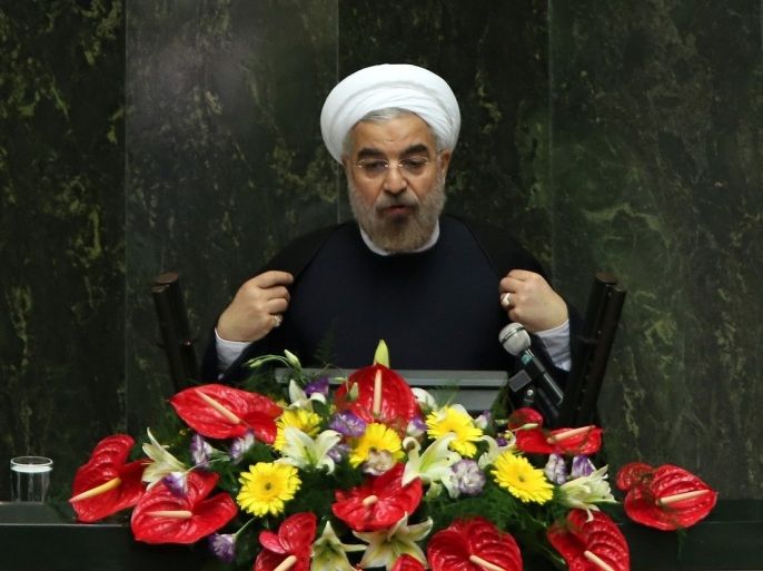 Iran's President Hasan Rowhani (below) delivers a speech to the parliament in Tehran on August 12, 2013. Iran's parliament began debating the 18-member cabinet proposed by President Hassan Rowhani ahead of a vote of confidence later in the week.