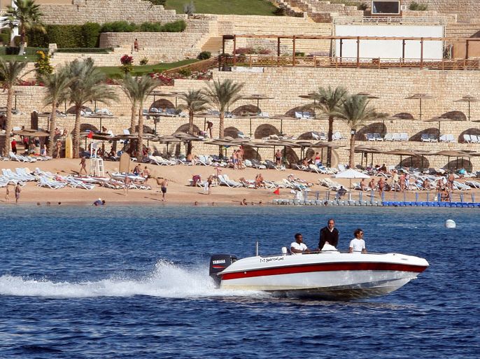 epa02484256 A police boat patrols the coast at the Red Sea resort of Sharm el Sheik, Egypt, 07 December 2010. A German tourist has been killed after a shark attack in the Red Sea off Sharm el-Sheikh, Egypt on 05 December 2010, Egyptian officials have subsequently imposed a 72-hour swimming ban in part of the area, one of Egypt's most popular tourist destinations. EPA/KHALED EL FIQI