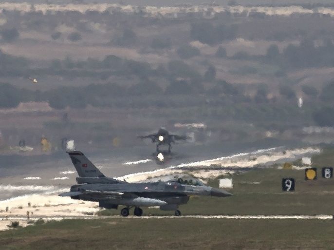 A US Air Force plane takes off as a Turkish Air Force fighter jet taxis at the Incirlik airbase, southern Turkey, Sunday, Sept. 1, 2013. U.S. President Barack Obama said he has decided that the United States should take military action against Syria in response to a deadly chemical weapons attack, but he said he will seek congressional authorization for the use of force.