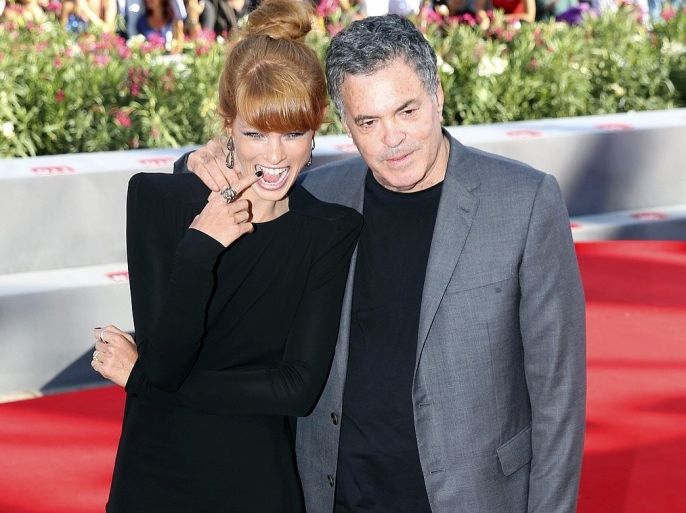 Director Amos Gitai (R) poses with actress Yuval Scharf during a red carpet for the movie "Ana Arabia" during the 70th Venice Film Festival in Venice September 3, 2013. The movie debuts at the festival.