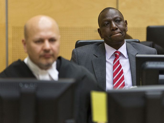 POS82 - The Hague, -, NETHERLANDS : (FILES) This picture taken on September 10, 2013 shows Kenya's Deputy President William Ruto ( R) in the courtroom before his at the International Criminal Court (ICC) in The Hague. Kenyan Vice President William Ruto must attend his crimes against humanity trial before the International Criminal Court and can only be excused under "exceptional circumstances," the ICC ruled Friday. "The appeals chamber deems it appropriate to reverse" an earlier ruling excusing Ruto from most of his trial before the Hague court, said Judge Sang-Hyun Song. AFP PHOTO / POOL - MICHAEL KOOREN