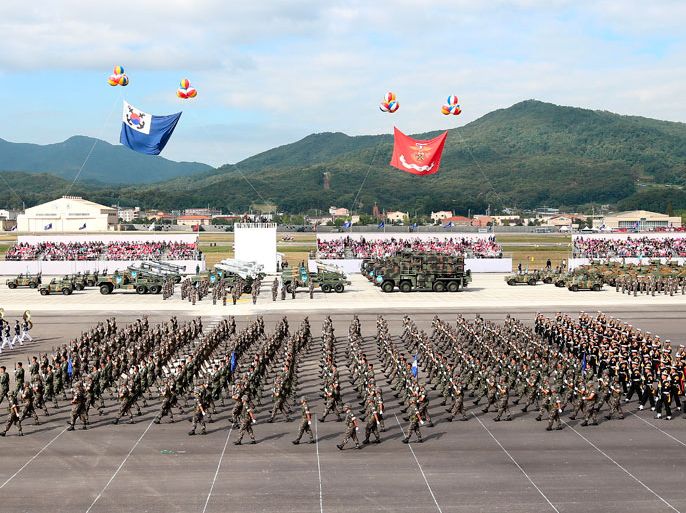 South Korean Army soldiers parade during the 65th Armed Forces Day at the military airport in Seongnam, Gyeonggi Province, South Korea, 01 October 2013. President Park Geun-Hye said during an Armed Forces Day ceremony, South Korea will build strong defense capabilities to deter threats from North Korea and render the North's nuclear weapons useless. EPA/JEON HEON-KYUN
