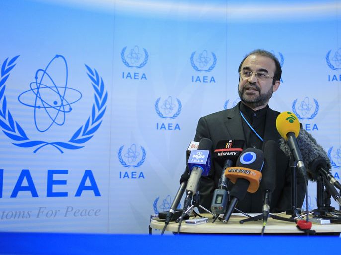 Iran's ambassador to the International Atomic Energy Agency (IAEA) Reza Najafi delivers a speech as he attends a press conference as part of the Board of Governors meeting at the UN atomic agency headquarters in Vienna on November 29, 2013. The UN nuclear watchdog said it was not yet ready to verify Iran's compliance with the recent deal with world powers, as Tehran invited inspectors to the key Arak site. AFP PHOTO