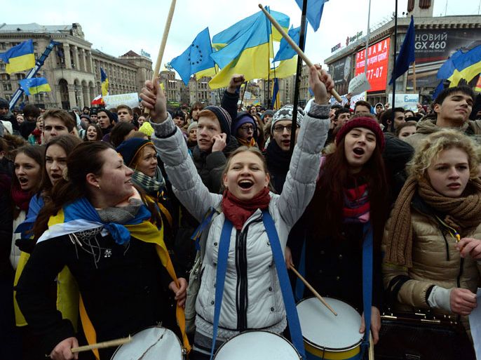 Ukrainian students shout slogans during a pro-European movement rally in central Kiev, on November 26, 2013, on a third day of protests over the government's decision to scrap a key pact with the EU. The Ukrainian authorities admitted for the first time on November 26 that Moscow had asked Kiev to delay signing a pact with Brussels that would have opened the ex-Soviet state's path to EU membership. AFP PHOTO /