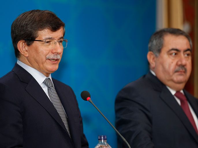 epa03944097 Turkish Foreign Minister Ahmet Davutoglu (L) addresses the media during a joint news conference with Iraqi Foreign Minister Hoshiyar Zebari (R) at the Foreign Ministry headquarters in Baghdad, Iraq, 10 November 2013. Zebari said on 10 November his country will rebuild ties with Turkey, signaling a fresh start in a diplomatic relationship that has frayed largely due to differences over Syria. Davutoglu began a two-day visit to Baghdad where he also met with Iraqi Prime Minister Nuri al-Maliki. EPA/THAIER AL-SUDANI/POOL 0