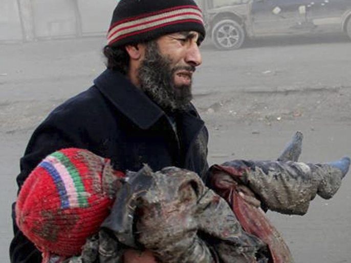 In this Sunday, Dec. 15, 2013 citizen journalism image provided by Aleppo Media Center, AMC, which has been authenticated based on its contents and other AP reporting, a Syrian man cries while holding the body of child who was killed following a Syrian government airstrike in Aleppo, Syria. The Britain based Syrian Observatory for Human Rights said Monday that dozens of children were among scores killed in airstrikes on several opposition areas a day earlier. (AP Photo/Aleppo Media Center, AMC)