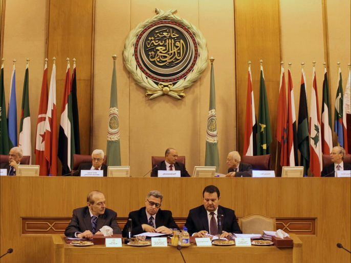 (Top L to R) Palestinian Senior Negotiatior Saeb Oreikat, Palestinian president Mahmud Abbas, Libyan Foreign Minister Mohamed Abdulaziz, Arab League Secretary General Nabil al-Arabi and Arab League Assistant Secretary-General Ahmed Ben Helli attend an Arab League Foreign ministers' meeting in the Egyptian capital Cairo on December 21, 2013. The meeting has been called at the request of Palestinian president Mahmud Abbas, League deputy secretary general Ahmed Ben Helli said, and aims to discuss troubled peace talks between the Palestinians and Israel. AFP PHOTO / HASSAN MOHAMED