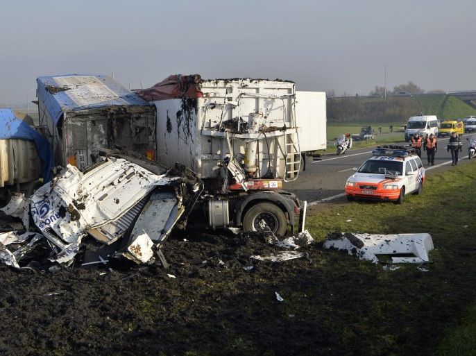 A picture shows wrecked cars at the site of a multiple collision accident on highway A19 towards Kortrijk near Zonnebeke-Beselare on December 3, 2013. At least one person was killed in the accident, which involved 40 to 50 vehicles, blocking the motorway in both directions. The accident was caused by dense fog. AFP PHOTO/BELGA/ERIC LALMAND == BELGIUM OUT ==