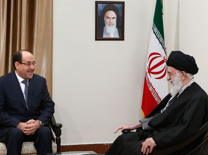 A handout picture released by the official website of Iran's supreme leader, Ayatollah Ali Khamenei, shows him (R) meeting with Iraqi Prime Minister Nuri al-Maliki in Tehran on December 5, 2013. Maliki arrived in Iran, state television reported, for two days of talks that will also focus on the conflict raging in Syria. AFP PHOTO/ KHAMENEI.IR