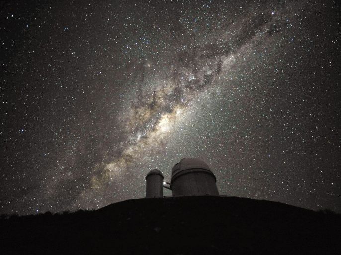 A undated handout image made available by European Southern Observatory, ESO, 12 September 2013, showing the ESO 3.6-metre telescope at La Silla, during observations. The Milky Way, our own galaxy, stretches across the picture: it is a disc-shaped structure seen perfectly edge-on. Above the telescopeÂ´s dome, here lit by the Moon, and partially hidden behind dark dust clouds, is the yellowish and prominent central bulge of the Milky Way. The whole plane of the galaxy is populated by about a hundred thousand million stars, as well as significant amounts of interstellar gas and dusts. The dust absorbs visible light and reemits it at longer wavelength, appearing totally opaque at our eyes. The ancient Andean civilizations saw in these dark lanes their animal-shaped constellations. By following the dark lane which seems to grow from the centre of the Galaxy toward the top, we find the reddish nebula around Antares (Alpha Scorpii). The Galactic Centre itself lies in the constellation of Sagittarius and reaches its maximum visibility during the austral winter season. The ESO 3.6-metre telescope, inaugurated in 1976, currently operates with the HARPS spectrograph, the most precise exoplanet âhunterâ in the world. Located 600 km north of Santiago, at 2400 metres altitude in the outskirts of the Chilean Atacama Desert, La Silla was first ESO site in Chile and the largest observatory of its time. EPA/ESO / SERGE BRUNIER
