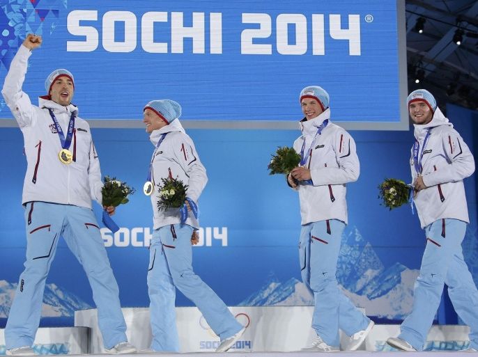 Gold medallists Norway's Magnus Hovdal Moan, Haavard Klemetsen, Magnus Krog and Joergen Graabak (L-R) celebrate during the victory ceremony for the Nordic combined team Gundersen large hill event at the Sochi 2014 Winter Olympic Games February 20, 2014. REUTERS/Eric Gaillard (RUSSIA - Tags: OLYMPICS SPORT SKIING)