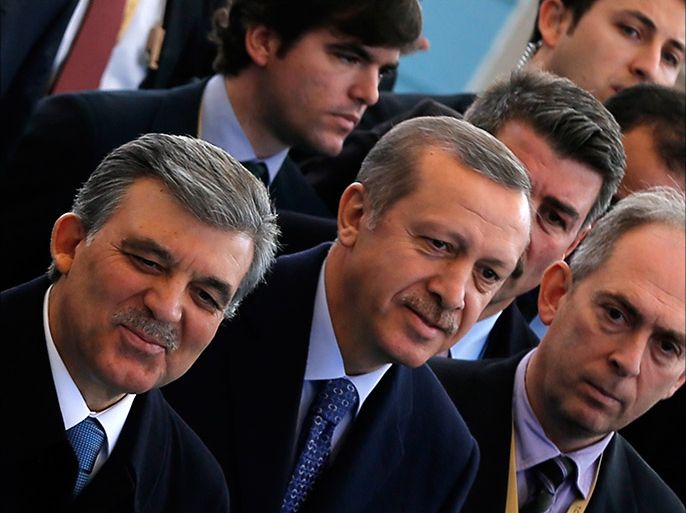 Turkish President Abdullah Gul (L) and Prime Minister Tayyip Erdogan arrive at an opening ceremony of a new line of the Ankara Metro in Ankara February 12, 2014