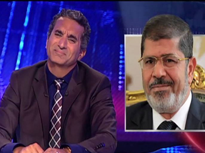 باسم يوسف سخر من مرسي في حلقات البرنامج (الجزيرة)