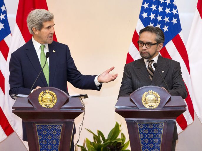 JAKARTA, -, INDONESIA : US Secretary of State John Kerry (L) speaks during a news conference with Indonesian Foreign Minister Marty Natalegawa at the Pancasila in Jakarta on February 17, 2014. US Secretary of State John Kerry on February 16 issued a clarion call for nations to do to more to combat climate change, calling it "the world's largest weapon of mass destruction". AFP PHOTO / Evan Vucci / POOL