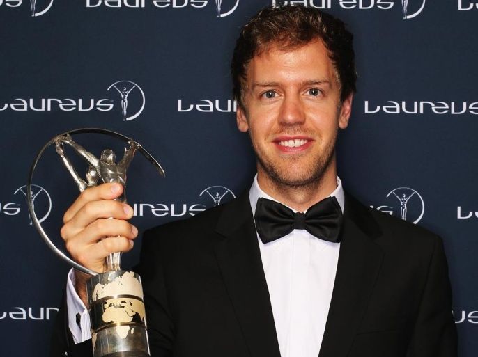 KUALA LUMPUR, MALAYSIA - MARCH 26: Sebastian Vettel winner of the Laureus World Sportsman of the Year award poses with their trophy during the 2014 Laureus World Sports Awards at the Istana Budaya Theatre on March 26, 2014 in Kuala Lumpur, Malaysia.
