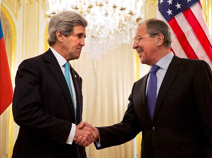 U.S. Secretary of State John Kerry (L) shakes hands with Russian Foreign Minister Sergei Lavrov before their meeting at the Russian Ambassador's residence in Paris March 30, 2014. REUTERS/Jacquelyn Martin/Pool (FRANCE - Tags: POLITICS)