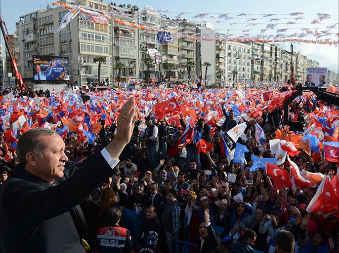 Turkey's Prime Minister Tayyip Erdogan greets his supporters during an election rally of his ruling AK Party in the Aegean port city of Izmir March 16, 2014. Turkey will hold municipal elections on March 30. REUTERS/Kayhan Ozer/Prime Minister's Press Office/Handout REUTERS/Handout (TURKEY - Tags: POLITICS ELECTIONS) NO SALES. NO ARCHIVES. FOR EDITORIAL USE ONLY. NOT FOR SALE FOR MARKETING OR ADVERTISING CAMPAIGNS. THIS IMAGE HAS BEEN SUPPLIED BY A THIRD PARTY. IT IS DISTRIBUTED, EXACTLY AS RECEIVED BY REUTERS, AS A SERVICE TO CLIENTS
