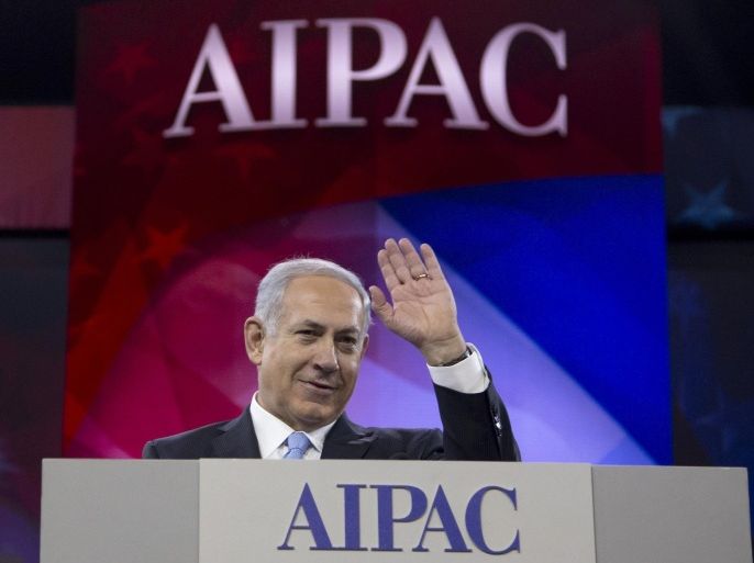 Israeli Prime Minister Benjamin Netanyahu waves to the cheering audience as he arrives to speak to the AIPAC meeting at the Washington Convention Center, Tuesday, March 4, 2014, in Washington. On Monday, the prime minister met with President Barack Obama at the White House. (AP Photo/Carolyn Kaster)