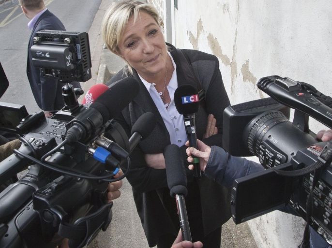 France's far right National Front leader Marine Le Pen, speaks to the media outside the party headquarters in Nanterre, west of Paris, Monday March 24, 2014. France's far-right National Front has conquered a symbolic northern town in Sunday's first round of municipal elections and led in some other cities, drawing calls by the governing left and rival right to stop the anti-immigration party's advance. The second round of municipal elections takes part on March 30 throughout France. (AP Photo/Michel Euler)