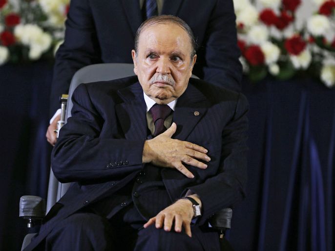 epaselect epa04183737 Algerian President Abdelaziz Bouteflika, re-elected for a fourth mandate, during the oath of office in Algiers, Algeria, 28 April 2014. Bouteflika was sworn in for a fourth term in a wheelchair. Bouteflika, who was reelected in April 17 elections, appeared stronger than in recent appearances but still fatigued as he took the oath of office in a televised ceremony at the Palais des Nations convention centre. The 77-year-old leader's quest for another five years in office, despite being too weak to campaign after suffering a stroke last year, had divided Africa's biggest gas producer. EPA/MOHAMED MESSARA