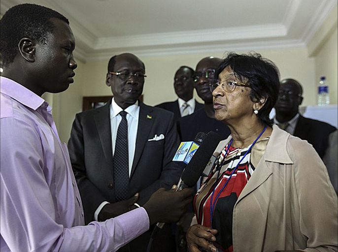 This photo released by the United Nations High Commissioner for Human Rights on April 28, 2014, shows UN High Commissioner for Human Rights Navi Pillay (R) speaking with journalists as South Sudan's Minister of Foreign Affairs Benjamin Barnaba Marial (C) looks on, in Juba, on April 28, 2014. Peace talks between South Sudan's government and rebels aimed at ending a four-month-old civil war resumed in the Ethiopian capital today, amid mounting global outrage over a wave of atrocities. Pillay was in South Sudan to discuss the human rights situation, in the wake of the recent mass killings in Bentiu and Bor. During her visit, Pillay plans to meet with President Salva Kiir and senior government officials, as well as opposition leaders. Last week the UN Security Council raised the threat of sanctions against both sides in the conflict, the government forces loyal to President Kiir, and rebels backing former vice president Riek Machar. Both sides have been implicated in atrocities and war crimes including massacres, rapes, attacks on UN bases sheltering civilians from ethnic violence and the recruitment of child soldiers. Kiir's government has been fighting Machar's forces, a mix of army defectors and ethnic militia since December 15, 2014.The four-month-old war has left possibly tens of thousands of people dead, and forced over one million to flee their homes. More than 78,000 civilians are currently crammed into eight UN bases in the country, while thousands have fled to neighbouring states, mainly Uganda and Ethiopia. AFP PHOTO / UNHCHR == RESTRICTED TO EDITORIAL USE MANDATORY CREDIT " AFP PHOTO / UNHCHR " NO MARKETING - NO ADVERTISING CAMPAIGNS - DISTRIBUTED AS A SERVICE TO CLIENTS ==