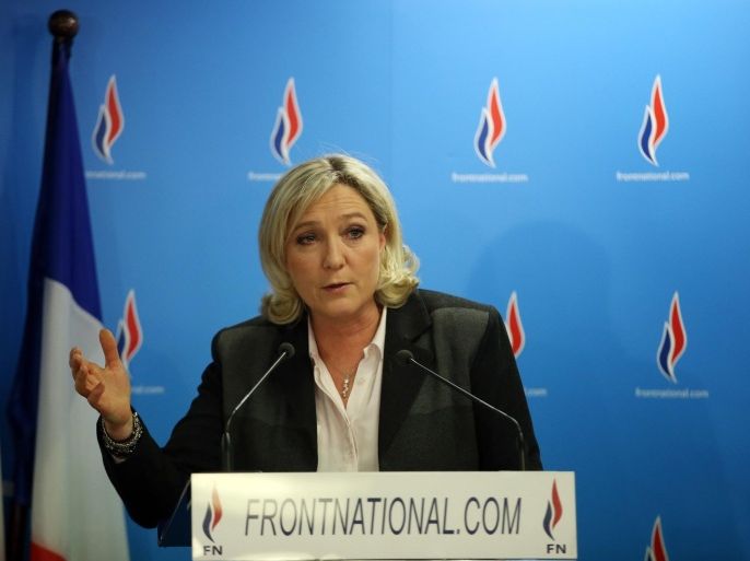 French far-right party Front National (FN) presidente Marine Le Pen speaks at the FN headquarters after the results of the France municpal elections' second round, on March 30, 2014 in Nanterre. French voters went to the polls on March 30 for a second round of local elections following a first round last week that saw the far right make sharp gains against President Francois Hollande's ruling socialists. AFP PHOTO / KENZO TRIBOUILLARD