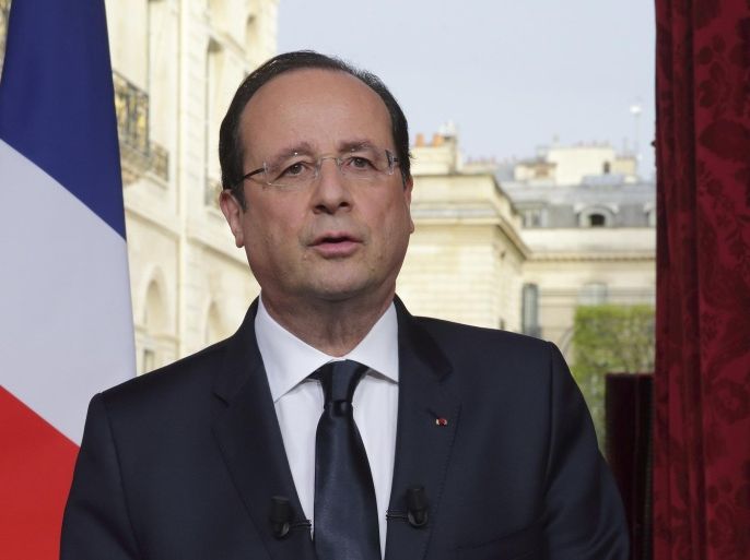 France's President Francois Hollande speaks after he recorded a speech to be broadcast on French television at the Elysee Palace in Paris, March 31, 2014. REUTERS/Philippe Wojazer