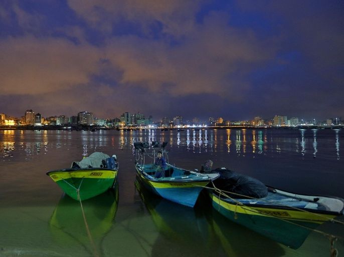 A Palestinian rides in a small boat at the port in Gaza City, Palestine, Saturday, March 29, 2014. (AP Photo/Hatem Moussa)