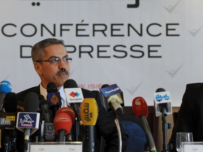 The President of the Independent Higher Authority for the Elections (ISIE), Shafik Sarsar (L) gives a press conference with ISIE member Riadh Bouhouch on May 27, 2014 in Tunis. The body responsible for organizing general elections by the end of the year in Tunisia urged politicians to agree on the election date as soon as possible, noting that otherwise these crucial elections for the country might be postponed. AFP PHOTO / FETHI BELAID
