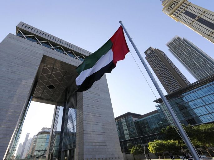 The UAE flag is seen in front of the Dubai International Financial Centre in Dubai November 10, 2013. REUTERS/Omr Mohamed