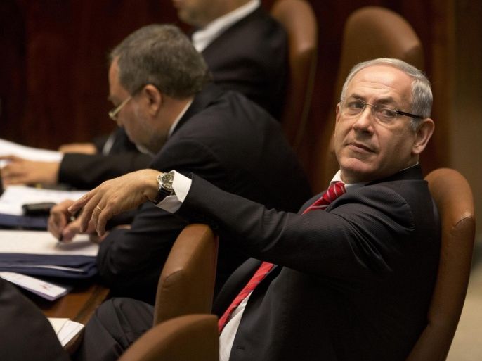 Israeli Prime Minister Benjamin Netanyahu listens while Canadian Prime Minister Stephen Harper speaks at Knesset, Israel's Parliament in Jerusalem, Monday, Jan. 20, 2014. (AP Photo/Ariel Schalit)