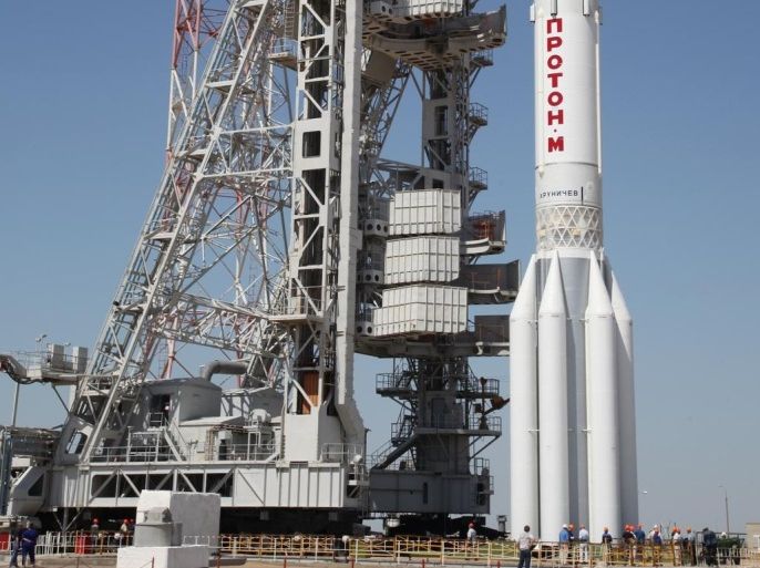 A picture taken on May 13, 2014, shows Russian Proton M rocket with the Express-AM4P communication satellite, which crashed today, rising at a launch pad in the Russian leased Kazakhstan's Baikonur cosmodrome. The Proton M rocket carrying the Express-AM4P European-built satellite reported to be worth $29 billion (21 million euros) fell today back to Earth shortly after liftoff in the latest accident to hit the country's once-proud space industry. AFP PHOTO
