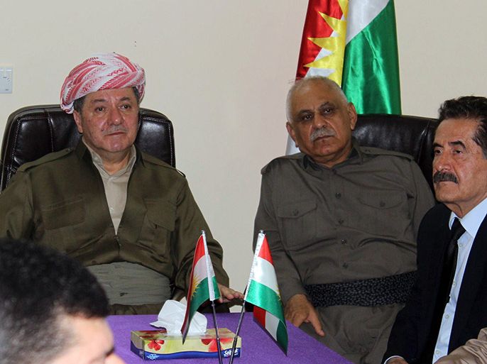 Kurdistan regional government president Massud Barzani (C) attends a meeting during his visit to the multi-ethnic city northern Iraqi of Kirkuk on June 26, 2014. Barzani made the trip to inspect Kurdish security forces deployed near Sunni Arab militant-controlled areas south and west of the city and raise morale, an official from his Kurdistan Democratic Party said. AFP PHOTO/STR