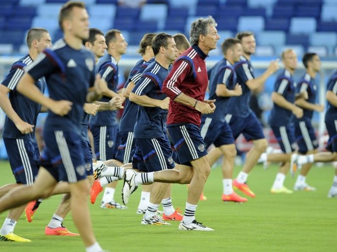The Russian team go through their paces during training at the Arena Pentanal stadium in Cuiaba, Brazil 16 June 2014. Russia play Korea Republic on 17 June 2014 in Cuiaba. The FIFA World Cup will take place in Brazil from 12 June to 13 July 2014. (RESTRICTIONS APPLY: Editorial Use Only, not used in association with any commercial entity - Images must not be used in any form of alert service or push service of any kind including via mobile alert services, downloads to mobile devices or MMS messaging - Images must appear as still images and must not emulate match action video footage - No alteration is made to, and no text or image is superimposed over, any published image which: (a) intentionally obscures or removes a sponsor identification image; or (b) adds or overlays the commercial identification of any third party which is not officially associated with the FIFA World Cup) EPA/JOSE COELHO EPA/JOSE COELHO EDITORIAL USE ONLY