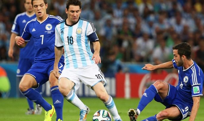 Bosnian players Muhamed Besic (L) and Miralem Pjanic (R) in action against Lionel Messi (C) of Argentina during the FIFA World Cup 2014 group F preliminary round match between Argentina and Bosnia and Herzegovina at the Estadio do Maracana in Rio de Janeiro, Brazil, 15 June 2014. (RESTRICTIONS APPLY: Editorial Use Only, not used in association with any commercial entity - Images must not be used in any form of alert service or push service of any kind including via mobile alert services, downloads to mobile devices or MMS messaging - Images must appear as still images and must not emulate match action video footage - No alteration is made to, and no text or image is superimposed over, any published image which: (a) intentionally obscures or removes a sponsor identification image; or (b) adds or overlays the commercial identification of any third party which is not officially associated with the FIFA World Cup) EPA/OLIVER WEIKEN