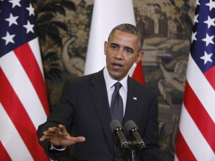 U.S. President Barack Obama answers a question during a joint news conference with Poland's President Bronislaw Komorowski at Belweder Palace in Warsaw, Poland, Tuesday, June 3, 2014. (AP Photo/Charles Dharapak)