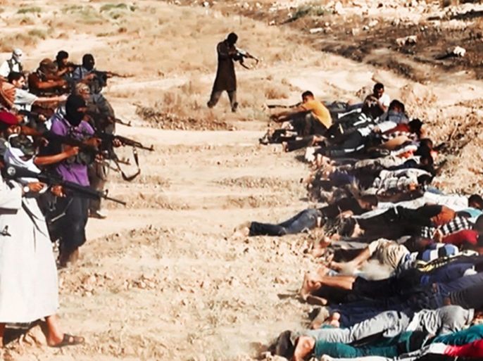 This image posted on a militant website on Saturday, June 14, 2014, which has been verified and is consistent with other AP reporting, appears to show militants from the al-Qaida-inspired Islamic State of Iraq and the Levant (ISIL) taking aim at captured Iraqi soldiers wearing plain clothes after taking over a base in Tikrit, Iraq. The Islamic militant group that seized much of northern Iraq has posted photos that appear to show its fighters shooting dead dozens of captured Iraqi soldiers in a province north of the capital Baghdad. Iraq's top military spokesman Lt. Gen. Qassim al-Moussawi confirmed the photos’ authenticity on Sunday and said he was aware of cases of mass murder of Iraqi soldiers. (AP Photo via militant website)