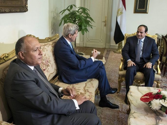 Egyptian Foreign Minister Sameh Shoukry, from left, listens as U.S. Secretary of State John Kerry talks with Egypt’s President Abdel Fattah el-Sissi before a meeting at the presidential palace in Cairo, Egypt, Sunday, June 22, 2014. Kerry on Sunday made the highest-level American visit to Egypt since President el-Sissi took office as Washington presses the former army chief to adopt more moderate policies. (AP Photo/Brendan Smialowski, Pool)