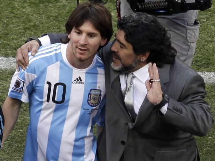 FILE .- In this June 17, 2010 file photo Argentina head coach Diego Maradona, right, and Argentina's Lionel Messi, left walk off the pitch after Argentina won the World Cup group B soccer match between Argentina and South Korea at Soccer City in Johannesburg, South Africa. (AP Photo/Marcio Jose Sanchez, File)