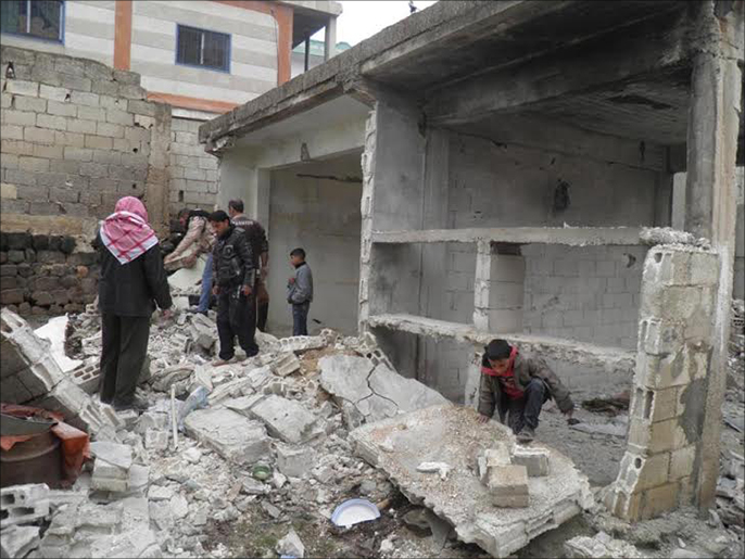 دمار خلفه قصف سابق لقوات النظام على مدينة الحولة (الجزيرة-أرشيف)