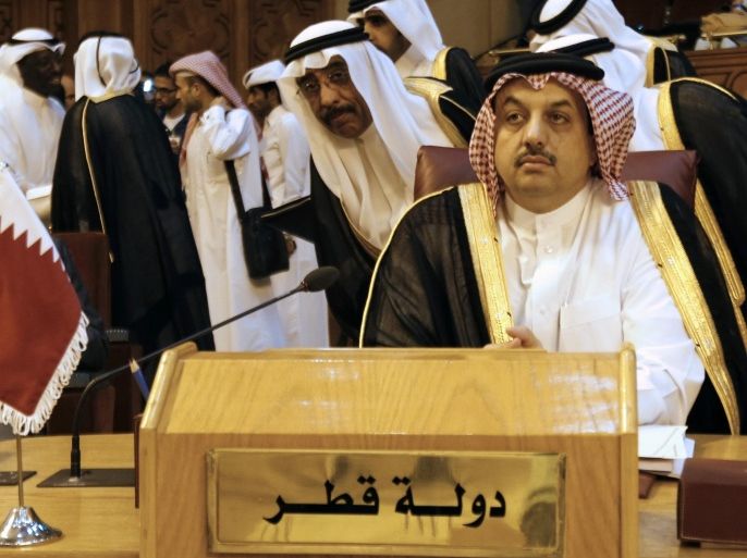 Qatar's Foreign Minister Khalid bin Mohammed Al Attiyah (front) attends an extraordinary session of the Arab League at the league's headquarters in Cairo July 14, 2014. Egypt launched an initiative on Monday to halt fighting between Israel and Palestinian militants, proposing a ceasefire to be followed by talks in Cairo on settling the conflict in which Gaza authorities say more than 170 people have died. REUTERS/Amr Abdallah Dalsh (EGYPT - Tags: POLITICS CIVIL UNREST)